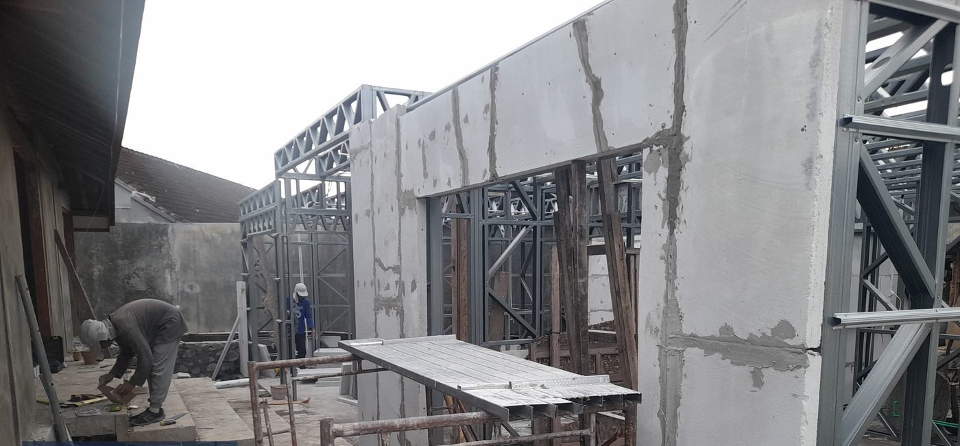ILO crew installing GRC wall panels on LGS frame, Kerobokan Bali