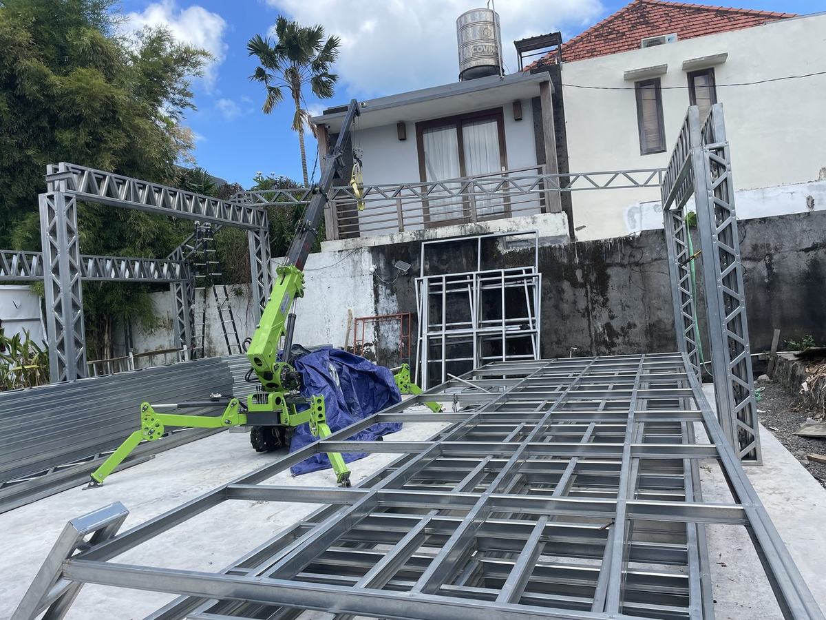 Spider crane placing LGS floor cassettes on site in Bali